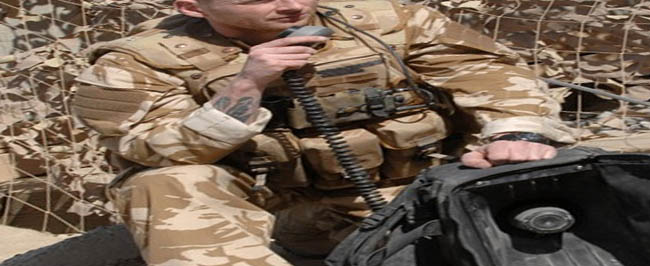 British PSYOPS soldier using a loudspeaker to communicate with the Taliban.